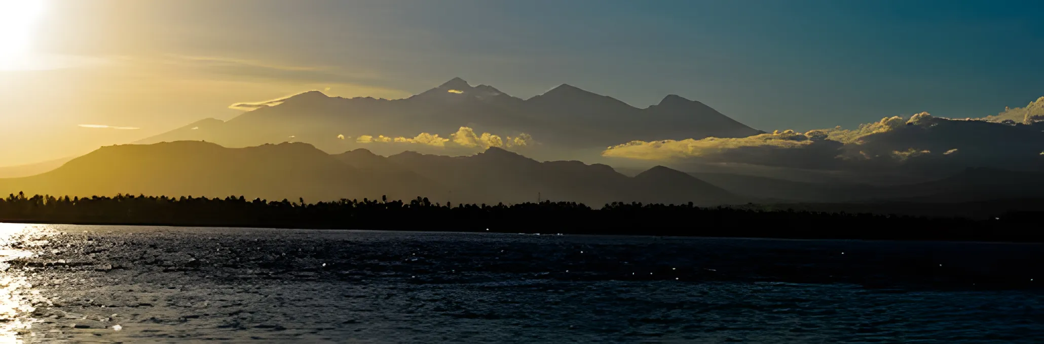 Mount Rinjani volcano on Lombok at sunrise, seen from the Gilis