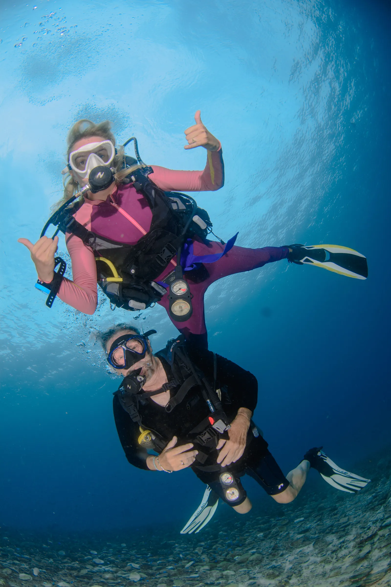 Diver flexing in the blue