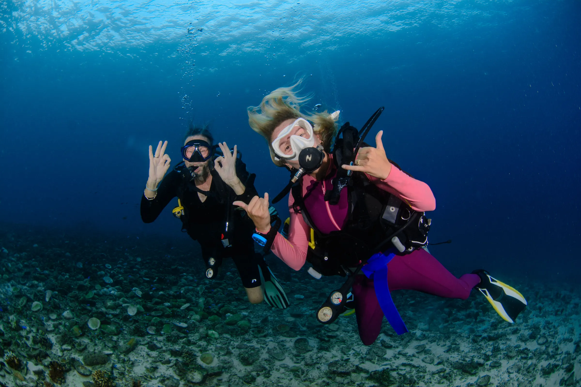 Two divers smiling at the camera