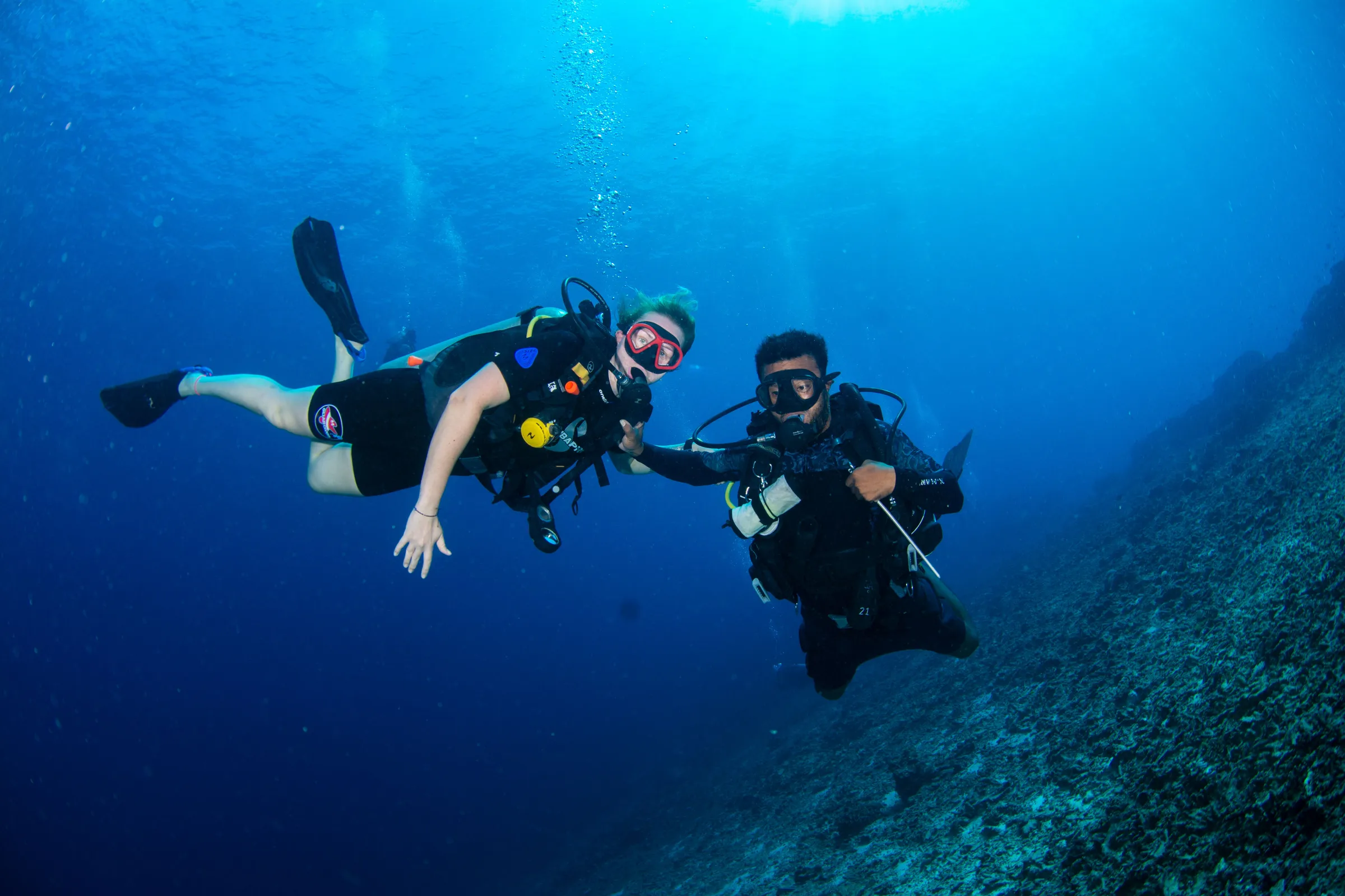Diver with strobes during photo dive