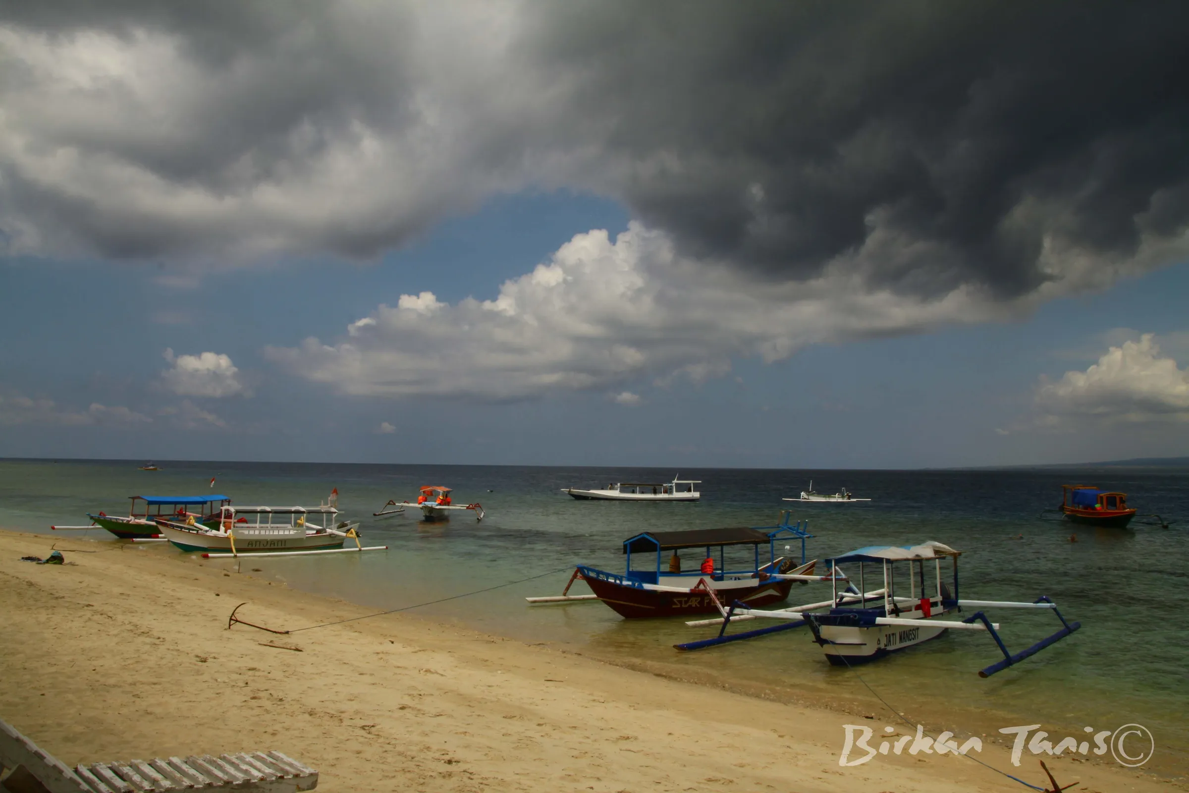 Beach with moored outriggers