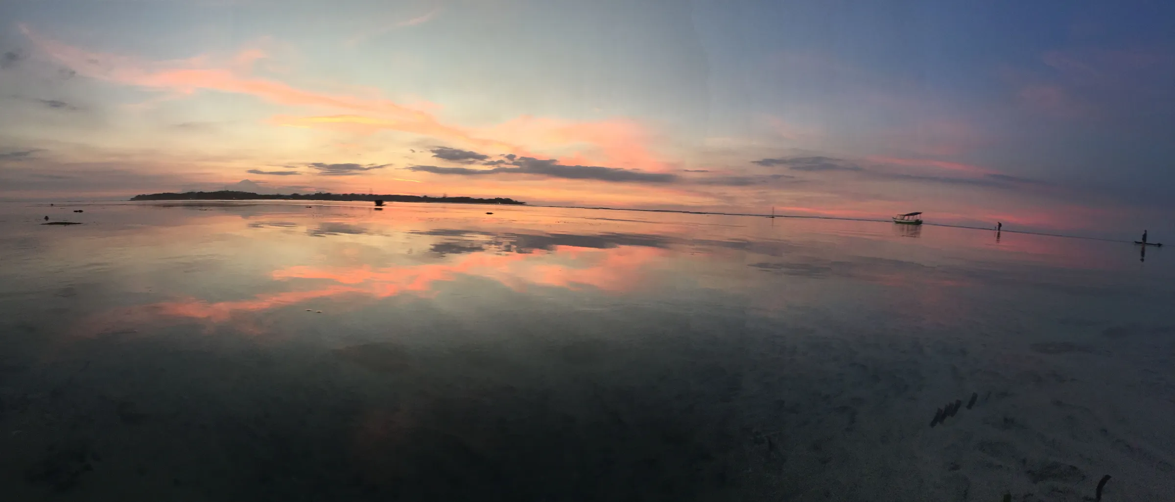 Reflective sunset over the strait