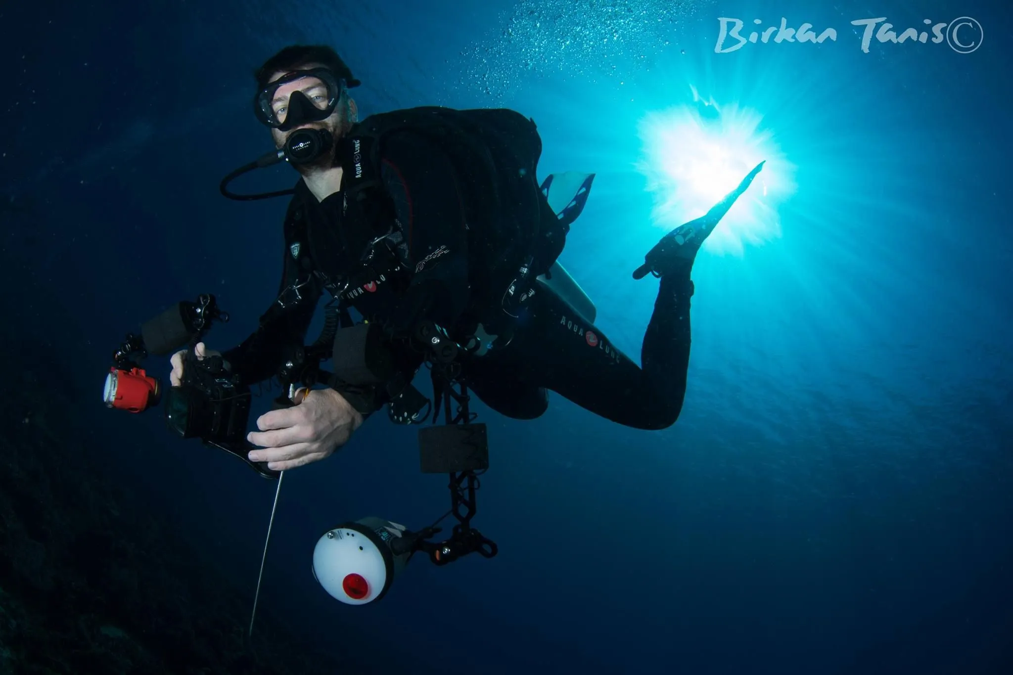 Diver giving OK with light